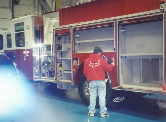 Engineer Ray Welsh examining Engine 4-9-1 on the Blue Floor at the Pierce Factory, 2004