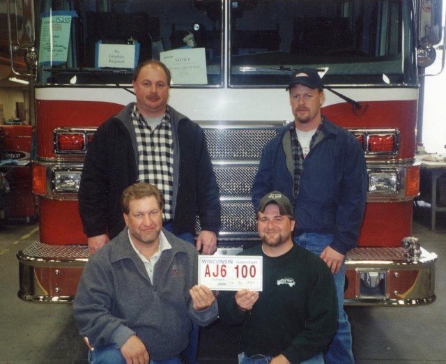 Engine 4-9-1 committee at the Pierce Factory; 2004... (Clockwise)Chief Rodney Gossert, Engineer Ray Welsh, Assistant Chief John Petershiem, and Deputy Chief John Beyer