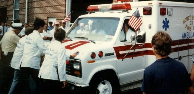 Ambulance 4-9 crew housing 33-A-1 at Honey Brook Fire Company's dual housing, building dedication, and parade in 1986  (Honey Brook Fire Co. photo)