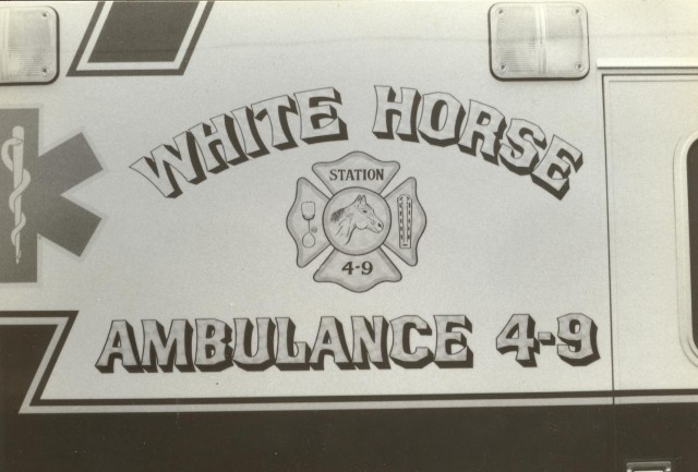 A close up of the gold leaf lettering on the side of the '93 ambulance